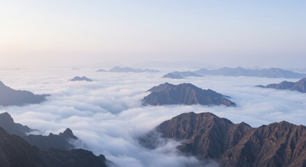 Majestic Mountain Peaks Rising Above a Sea of Clouds.