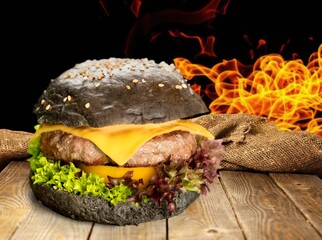 Cheese Burger with beef, fire on background