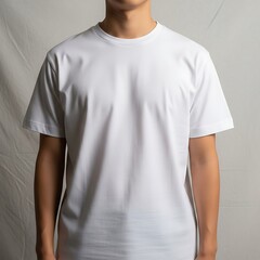 A plain white t-shirt is displayed against a simple backdrop, highlighting its smooth texture and clean lines.