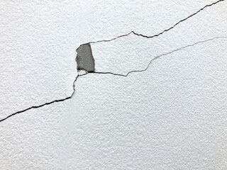 Obraz premium Cracked and peeling paint on white concrete wall like on top of screwdriver picture