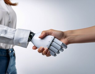 Human Hand Shaking Hands with Robotic Hand on White Background