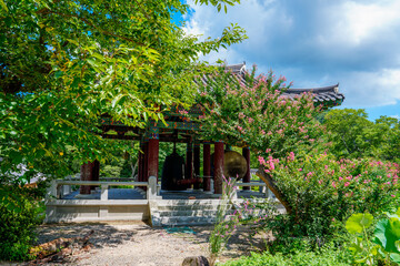 Early summer scenery of Girimsa Temple, an old cultural heritage site in Gyeongju, Korea, with red Crape Myrtle tree flowers in bloom.