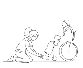 A girl ties shoelaces to disable a man