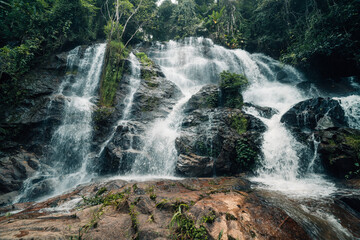 Obraz premium Waterfall landscape in natural forest, watershed and environment in tropical forest of Thailand