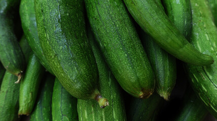 Fresh organic ridge gourd (tori) with natural green skin,  close up shot showing texture and freshness, healthy seasonal vegetable rich in nutrients, perfect for food, agriculture and market concept