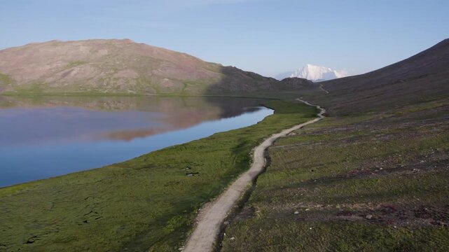Early morning by Sheosar Lake with Nanga Parbat visible in the distance along the Deosai park road. Deosai