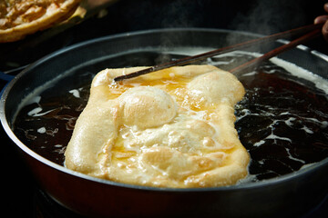 Close-up of fried eggs in frying pan
