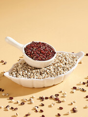 Job's tears, Coix lacryma-jobi, adlay or adlay millet and red beans in a bowl close up