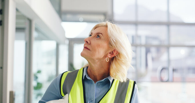 Engineer, construction site and mature woman for urban planning, thinking or decision for architecture development. Inspection, insight and contractor with project management for civil engineering - Powered by Adobe