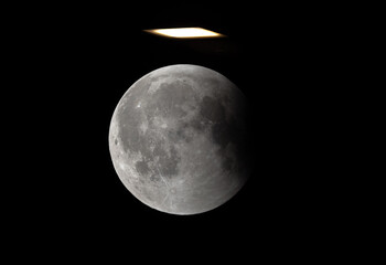 A double exposure image of umbral phase of total Lunar eclipse and street light visible at Bahrain on 07 September 2025.