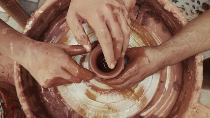 Shaping a Clay Pot in a Ceramics Workshop - Powered by Adobe