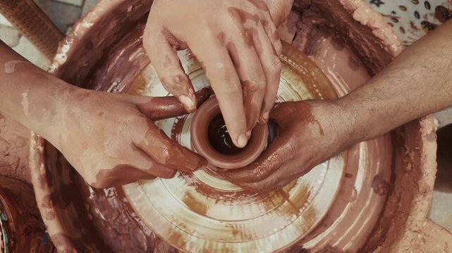 Shaping a Clay Pot in a Ceramics Workshop