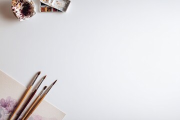 Minimalist Art Scene with Brushes and Watercolors for Hobbyist Creation