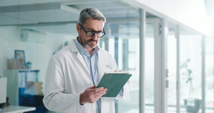 Reading, tablet and glasses with doctor in hospital for healthcare report, research grant and planning. Medical case review, clinical guidelines and telehealth app with mature person for insurance