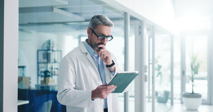 Reading, tablet and thinking with doctor in hospital for healthcare report, research grant and reflection. Medical case idea, clinical guidelines and telehealth app with mature person for vision