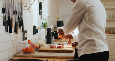 Fototapeta premium Chef hands, team and steak seasoning in kitchen for meal prep, learning recipe and enhance flavor. People, mentor and intern with spices on beef for teaching meat dinner, culinary skill and guidance