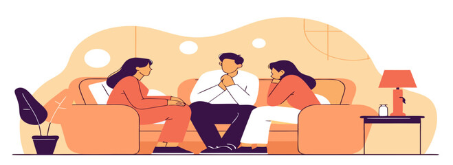 Three individuals engaged in a thoughtful conversation while sitting on a cozy living room couch with warm tones and soft lighting.