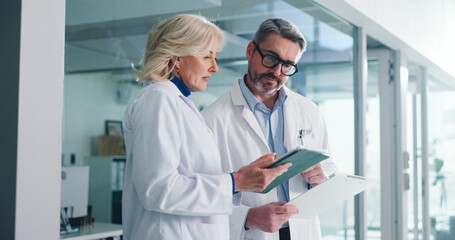 Teamwork, tablet and help with doctors in hospital for healthcare report, research grant and...