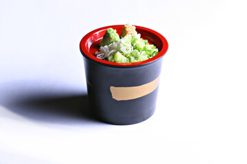 Yakumi a mixture of myoga, shiso leaves, green onions, wasabi and ginger as condiments (Yakumi the natural condiment) in white background