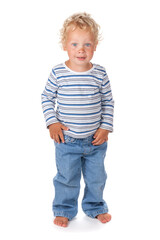 A cute and funny blue-eyed baby dressed in jeans
