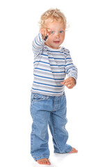 A cute and funny blue-eyed baby dressed in jeans