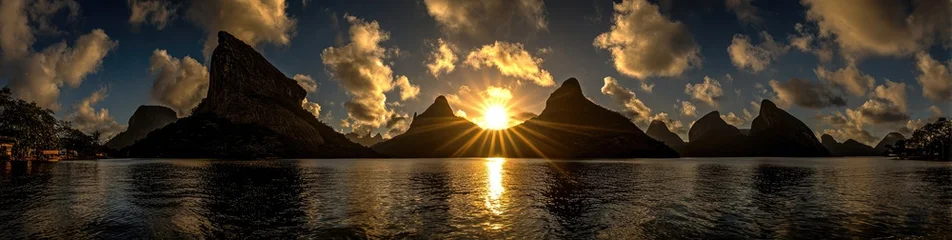 Wanddecoratie Reflectie Dramatic sunset over a tranquil lake, with dramatic mountain silhouettes reflected in the water  © nurman