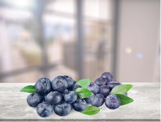 Fresh tasty sweet blueberries on desk