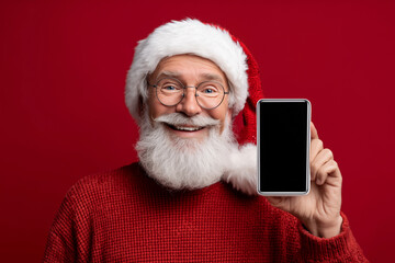 A man in a red sweater and a santa hat holding a cell phone