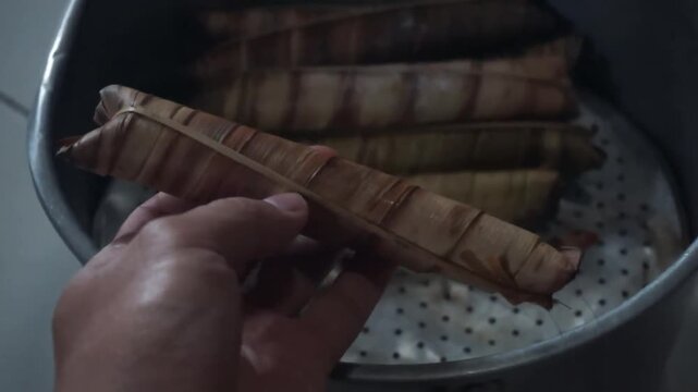 traditional Indonesian food called lepet in hand