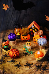 important pumpkin gathering in the witch's cobweb forest with spiders about preparation for All Saints Day, vertical, creative focus