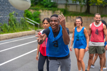 Rugby player catching ball during training with teammates