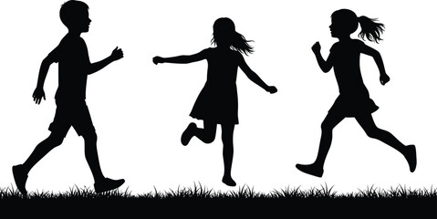 children playing outdoors in silhouette form on grassy field
