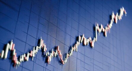 Upward trending stock chart on a blue grid