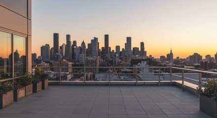 A cityscape panorama unfolds from a modern rooftop terrace at sunset, showcasing a tranquil urban view.