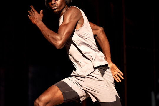 Athletic man sprinting during a fitness workout in dynamic motion