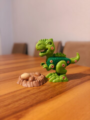 Green Tyrannosaurus Rex Toy with a Nest and Eggs
