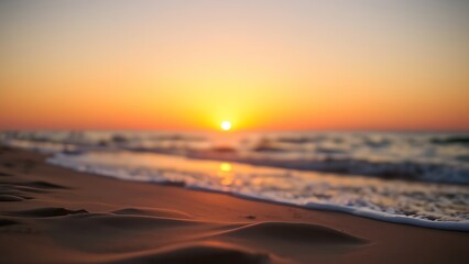 Serene beach sunset with golden tones and a softly focused horizon, creating a peaceful atmosphere.