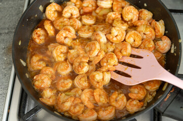 Fried shimps on frying pan,cooking shrimp in a pan in the kitchen, seafood homemade 