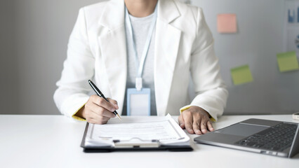 Business woman employer holding resume hiring recruit looking cv resume to hire candidates, analyzing information before job interview. Recruitment concepts