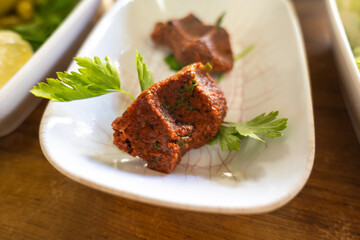Cig Kofte (raw meatball in Turkish) on plate, traditional Turkish cuisine popular in Turkey