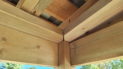 Close-up of wooden beam intersection in outdoor construction project