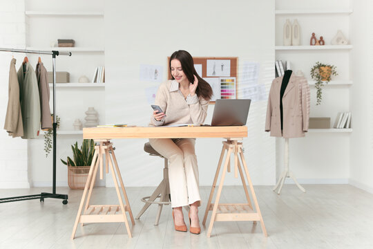 Fashion designer working in studio. Creating stylish clothes