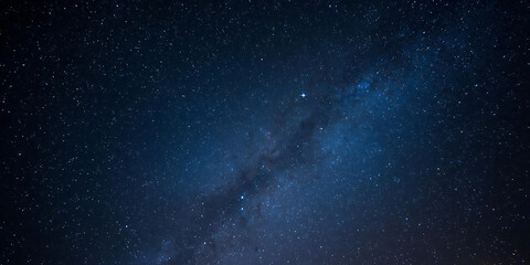 Fototapeta premium Starry night sky with Milky Way stretching diagonally