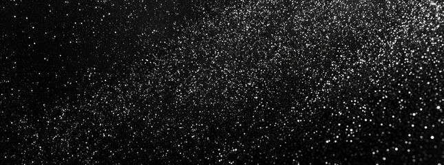 Obraz premium A mesmerizing display of sparkling particles against a dark background, creating a magical atmosphere