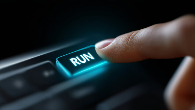 Run key illuminated on keyboard with finger pressing button illustrating ai impact on jobs and digital automation inspiring action and urgency