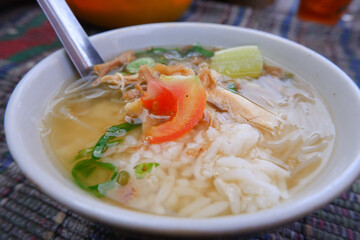 Soto is a traditional Indonesian food consisting of noodles, chicken and broth combined into one.
