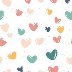 Seamless hand drawn pattern with colorful pastel hearts and small doodle elements on white background