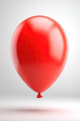 Single vibrant red balloon against plain white background