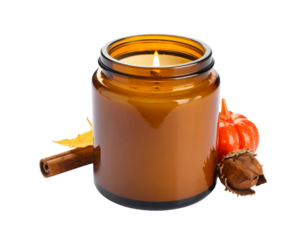 Amber glass jar candle burning brightly, surrounded by autumn leaves, cinnamon stick, and miniature pumpkins; close-up studio shot against a white background, warm
