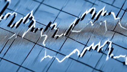 Close-up of a financial chart with fluctuating lines on a gridded background